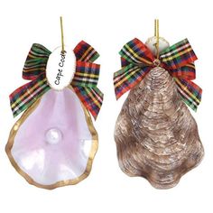 two seashell ornaments with bows on them