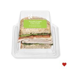 a sandwich in a plastic container with the label fresh from our deli