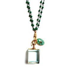 Handcrafted one-of-a-kind necklace, vintage square glass locket pendant on a doubled green onyx dainty chain, an oval green agate pendant, a vintage charm holder and a vintage magnetic clasp. Wear it long or doubled over short. Dress it up or down, chic timeless classic and super stylish! The Necklace measures 30" in length Green onyx chain Vintage pendant Vintage magnetic brass clasp Made with love in Los Angeles Complimentary gift wrapping provided All sales final. Luxury Green Locket Necklaces, Luxury Green Locket Necklace, Green Necklace Locket, Luxury Vintage Square Pendant Necklace, Luxury Vintage Necklace With Rectangular Pendant, Glass Locket Pendant, Charm Holder, Glass Locket, Dainty Chain