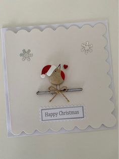 a christmas card with a bird on a branch