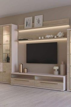 a living room with a large tv on the wall and cabinets in front of it