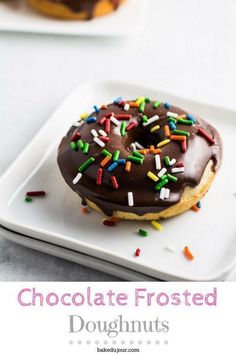 chocolate frosted doughnuts with sprinkles on a white plate