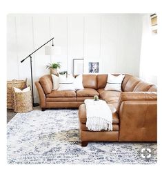 a living room with two couches and a rug