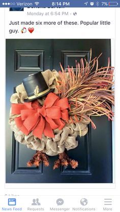 an image of a wreath made out of burlocks and bows on the front door