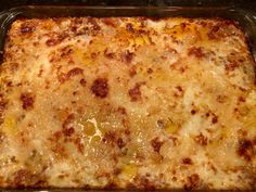 a casserole dish with cheese and meat in it