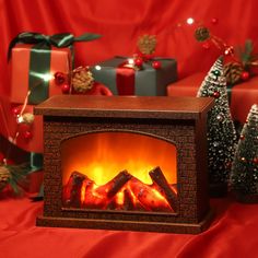 a fireplace with presents around it on a red background