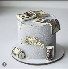 a birthday cake decorated with money and the words happy birthday