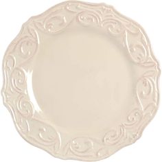 an empty white plate with swirl designs on the rim and bottom, isolated against a white background