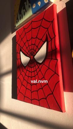 there is a spiderman painting on the wall