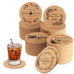 four cork coasters with different labels and a drink in a glass next to them