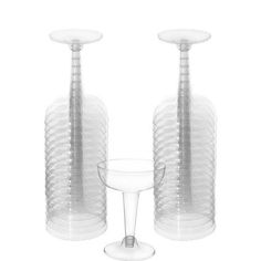 two clear vases sitting next to each other