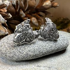 TAKE AN ADDITIONAL 20% OFF THE ALREADY REDUCED SALE PRICE - ADDITIONAL 20% IS DEDUCTED AT CHECKOUT with code SAVE20 These meticulously crafted Wolf Spirit earrings, inspired by Viking culture, are sure to captivate. Featuring stunning knot work and a majestic wolf head gazing out into the world, these earrings are made of solid sterling silver. The intricate details of the wolf's head, including the knot work on its ears, make these earrings a true masterpiece. Solid sterling silver. 1/2" x 1/2" Wolf Jewelry Silver, Wolf Earrings, Celtic Wolf, Majestic Wolf, Viking Wolf, Viking Culture, Sale Off, Wolf Spirit, Irish Jewelry