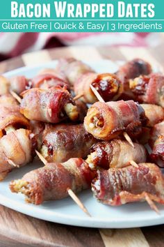 bacon wrapped dates on a white plate with toothpicks in the foreground and text overlay