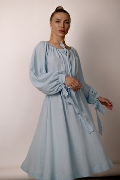 Indulge in timeless romance with our A-line midi dress featuring wide puffy sleeves, a captivating neckline, and a graceful long fabric belt. Crafted from soft cotton muslin, this enchanting piece is designed to elevate your elegance with every step. 💠 See other Products : https://www.etsy.com/de-en/shop/LuluComfort 📸 MODEL The model in the pictures is 164cm/5'3" tall and wears a size S; 📌 SIZES 💠 Available in a range of sizes to ensure the perfect fit for every body type: ➡️ XS: US 2 / UK 6 Spring Daywear Puff Sleeve Dress With Bishop Sleeves, Spring Puff Sleeve Dress With Bishop Sleeves For Daywear, Spring Billowy Puff Sleeve Dress With Lantern Sleeves, Elegant Spring Peasant Dress With Puff Sleeves, Spring Flowy Midi Dress With Lantern Sleeves, Modest Spring Dress With Bishop Sleeves, Billowy Lantern Sleeve Midi Dress For Spring, Billowy Spring Midi Dress With Lantern Sleeves, Billowy Midi Dress With Lantern Sleeves For Spring