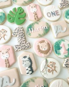 decorated cookies are arranged in the shape of animals