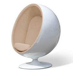 a white ball chair sitting on top of a metal stand next to an egg shaped chair