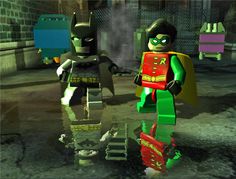 two lego batmans are walking in the street