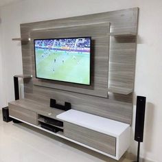 a flat screen tv mounted to the side of a wall