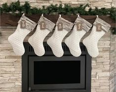 stockings hanging from the mantel over a fireplace