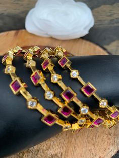 Traditional Bangles in Golden Finish Comes in Set of 4 (2 for each hand)Color : GoldenStones : CZ Red Stone Traditional Bangles, Stone Bangle, Red Stone, Social Events, Hand Coloring, Indian Jewelry, Bangles, Charm Bracelet, Stone