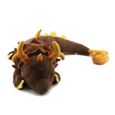 a stuffed animal that is laying down with horns on it's head and legs