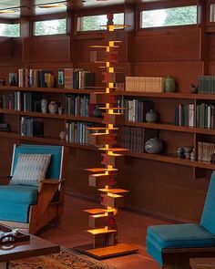 a living room filled with furniture and bookshelves