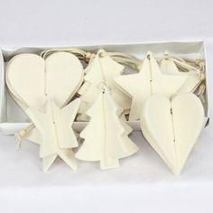 white wooden christmas decorations in a box