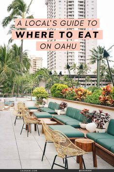 an outdoor seating area with palm trees and buildings in the background text reads a local's guide to where to eat on oauu