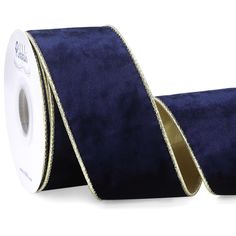 a roll of blue velvet ribbon with gold sequins on the edge and side