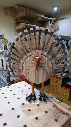 a wooden turkey sitting on top of a table