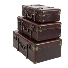 three pieces of brown leather luggage stacked on top of each other, one with two handles