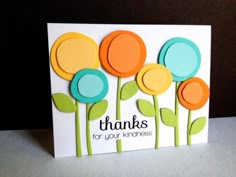 a thank card with colorful flowers on it