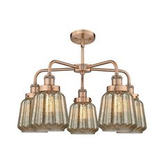 three light chandelier with glass shades and metal fittings on the bottom half