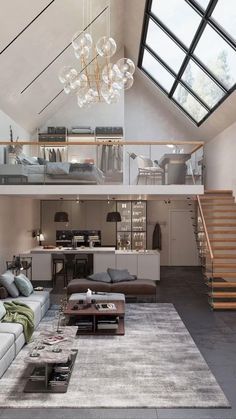 a living room filled with lots of furniture and a stair case in front of it