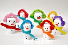 the snowmen are all wearing scarves