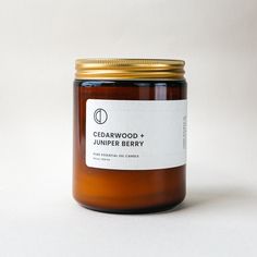 a jar filled with honey sitting on top of a white table