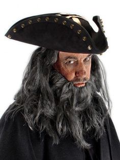 a man with long gray hair wearing a pirate hat and black cloak on his head