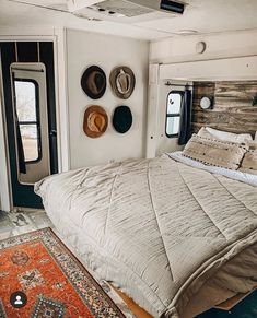 a bed sitting inside of a bedroom next to a doorway