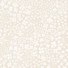 a white flower pattern on a beige background