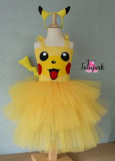 a yellow dress with a pikachu face on it