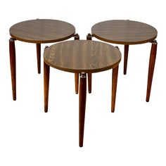 two wooden tables sitting next to each other