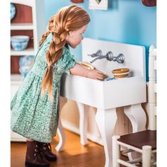 What's a kitchen without a sink? 18" dolls cook and their friends need a place to wash, prep, and clean. They'll do it here with a bit of flare. Clever design offers faucet handles that turn, a basin with draining shelves on each side and a bowl deep enough for 18" dolls to wash veggies, pots or plates. High quality wooden construction features a backsplash, cabriolet legs and the enameled look of yesteryear - sized right for 18" dolls. Sink stands 13"H at the right height for an 18" Doll. Overa Ag Doll Furniture, American Girl Kitchen, Styled Kitchen, Vintage Style Kitchen, How To Make Skirt, 1930s Fashion, Faucet Handles, Washing Dishes, Farmhouse Sink