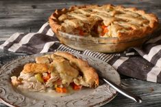 a chicken pot pie on a plate with a fork