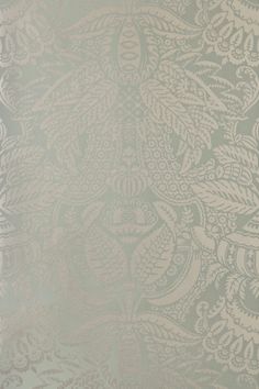 a white and grey wallpaper with an intricate design on it's side,