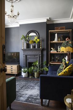 a living room filled with furniture and a fire place