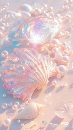 three seashells with bubbles and water droplets on the bottom, all in pastel colors