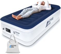 an inflatable bed with a sleeping man on it and a bag next to it