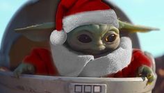 the baby yoda is wearing a santa hat and sitting in a bucket with his eyes wide open