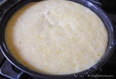 a pan filled with food sitting on top of a stove