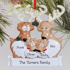 three reindeer family ornament hanging from a christmas tree